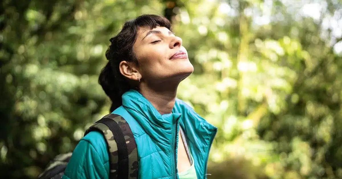 female eyes closed in woods 1200