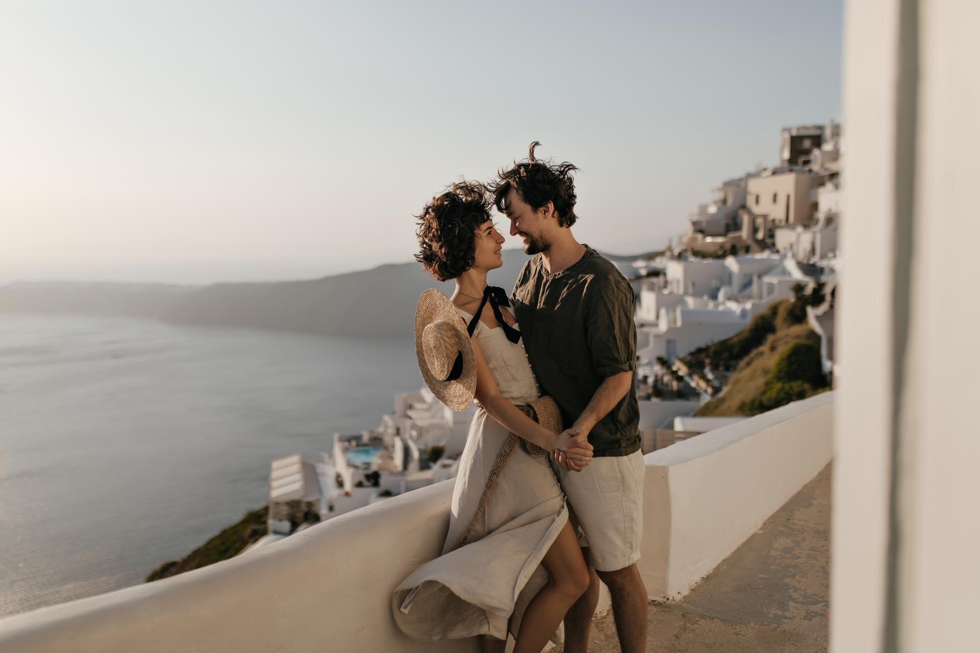 portrait couple background greek city brunette lady beige dress man stylish outfit looks each other with love sea background 197531 30063