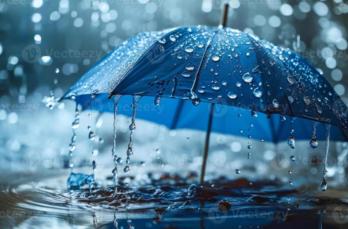 blue umbrella with water drops close up in the rain with beautiful bokeh light photo