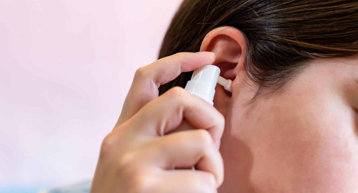 girl using a spray to clean the ears clogged by t 2023 11 27 05 34 55 utc scaled 1