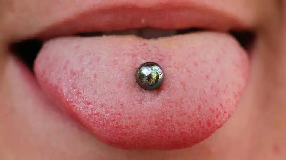 a picture of a tongue piercing where the healing process has completed