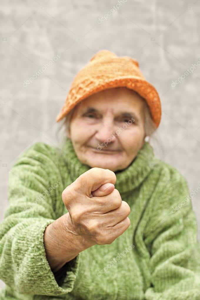 depositphotos 54830077 stock photo elderly woman showing fig sign