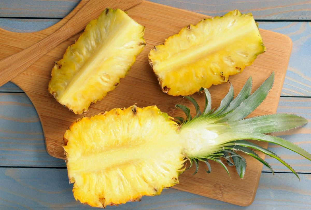 bhg slicing a pineapple on a woo scaled 1