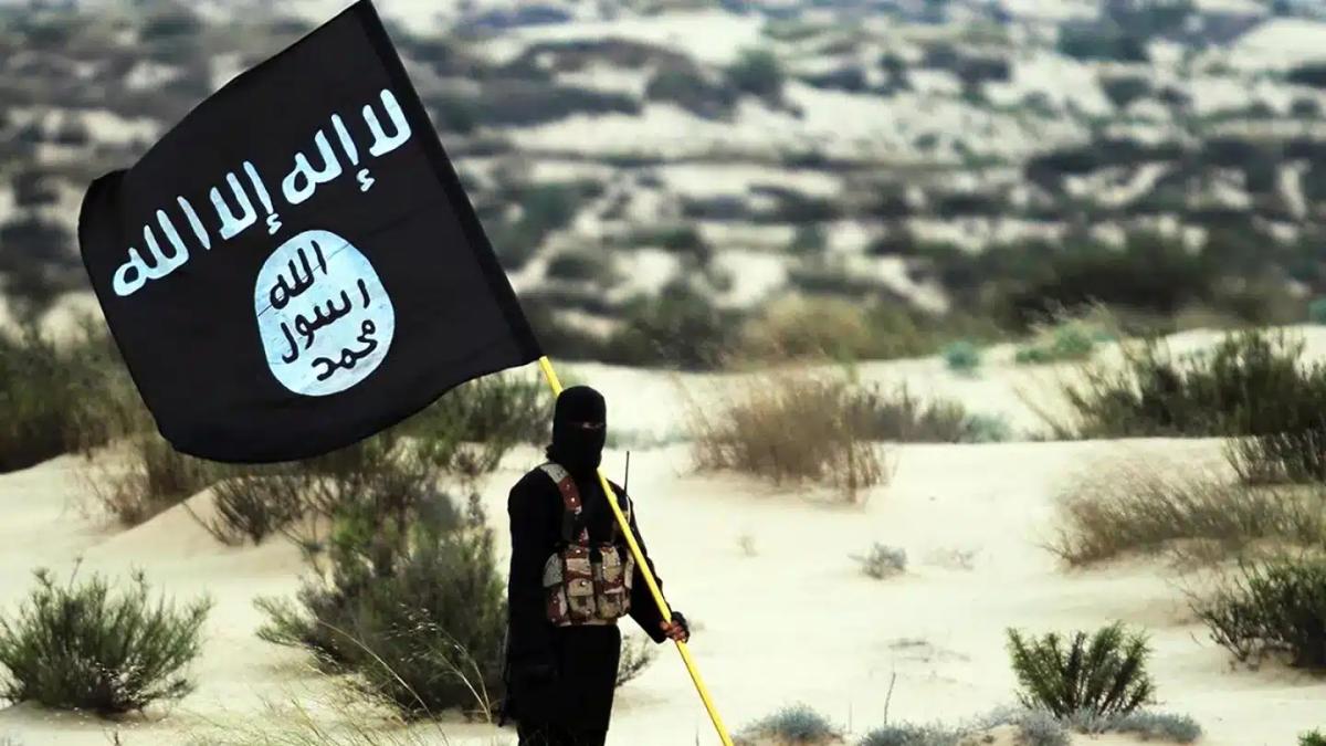 soldier holds isis flag