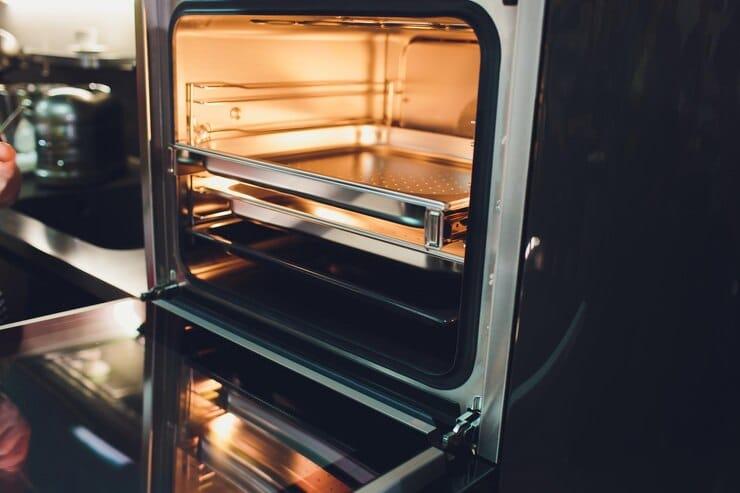 empty open electric oven with hot air ventilation new oven door is open light is 152904 45046