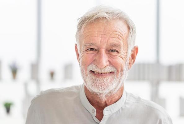 portrait of happy senior man looking at camera smiling elderly caucasian old man photo