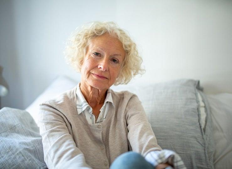 close up elderly woman relaxing at home