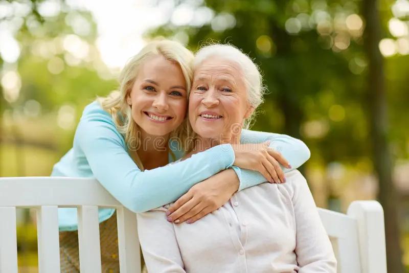daughter senior mother hugging park bench family generation people concept happy smiling young sitting 143342447